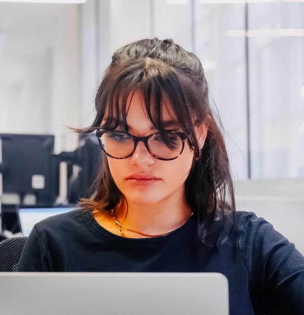  A medical writer focussed intently on her laptop computer