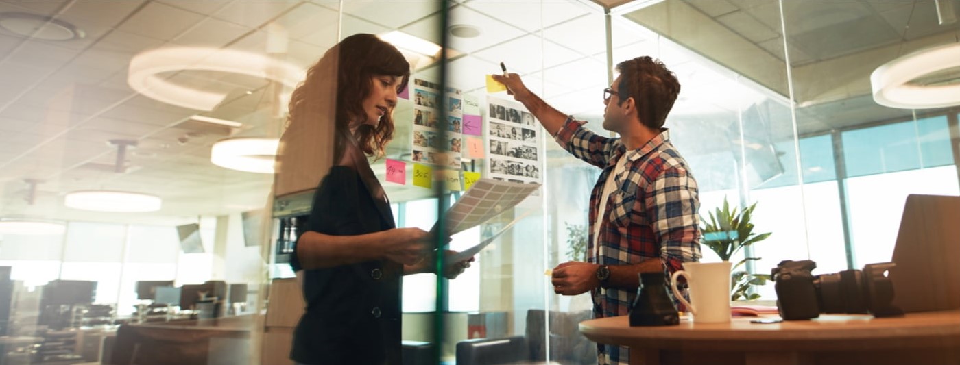 Two marketing consultants working collaboratively in an office